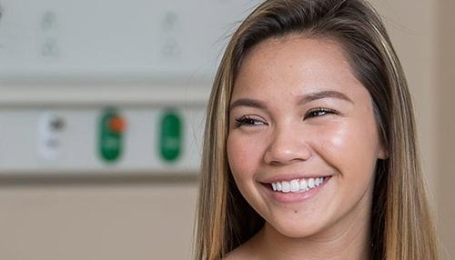 An adolescent woman smiling at Johns Hopkins All Children's Hospital