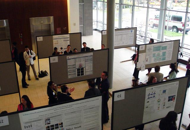 attendees looking at posters