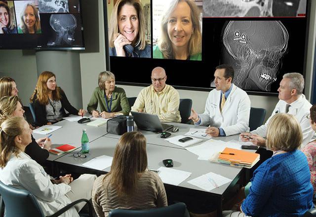 Johns Hopkins Cochlear Implant Specialists in a conference room