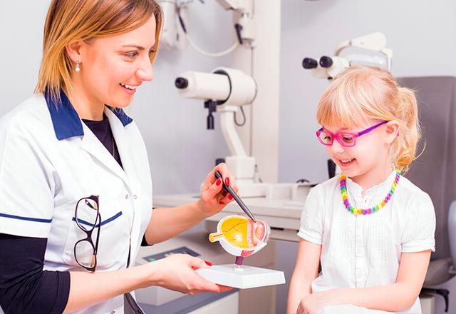 eye doctor performing fun optical test with child